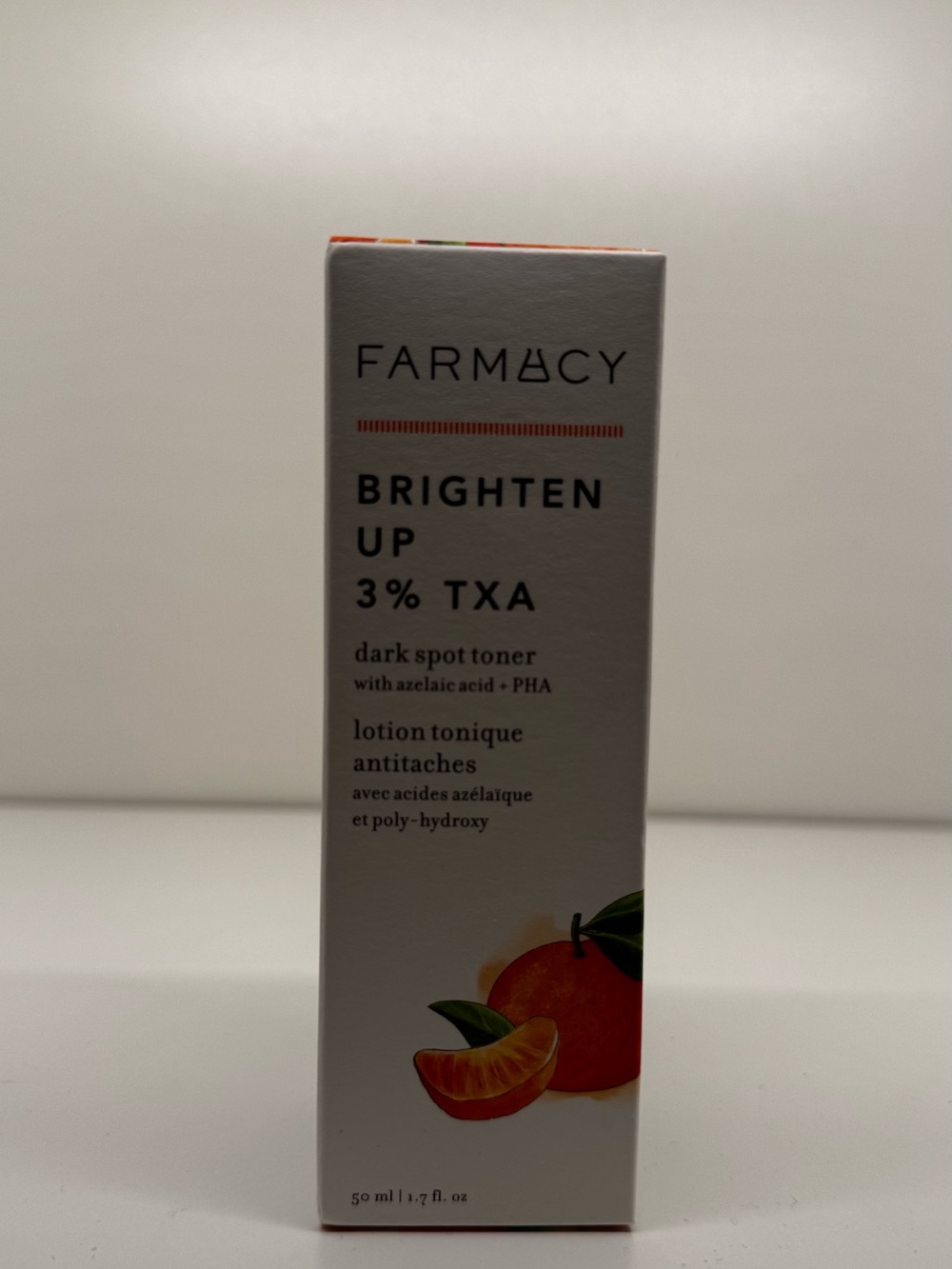 Farmacy Brighten Up Dark Spot Toner — White & Orange Accents